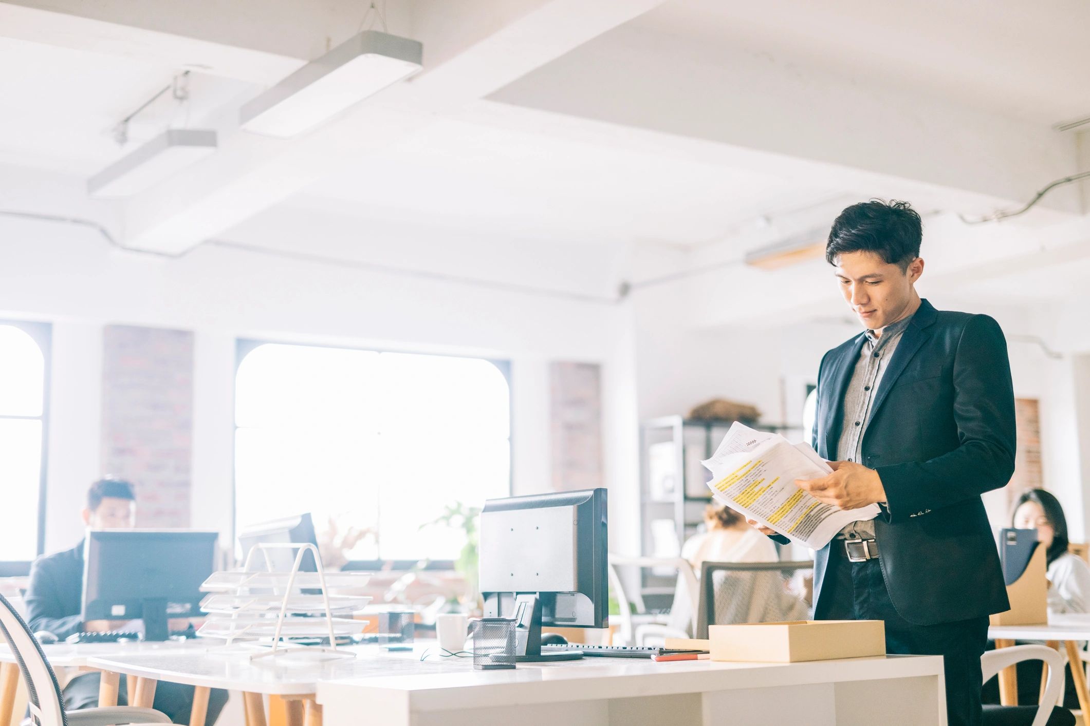 Man reviewing documents at a desk