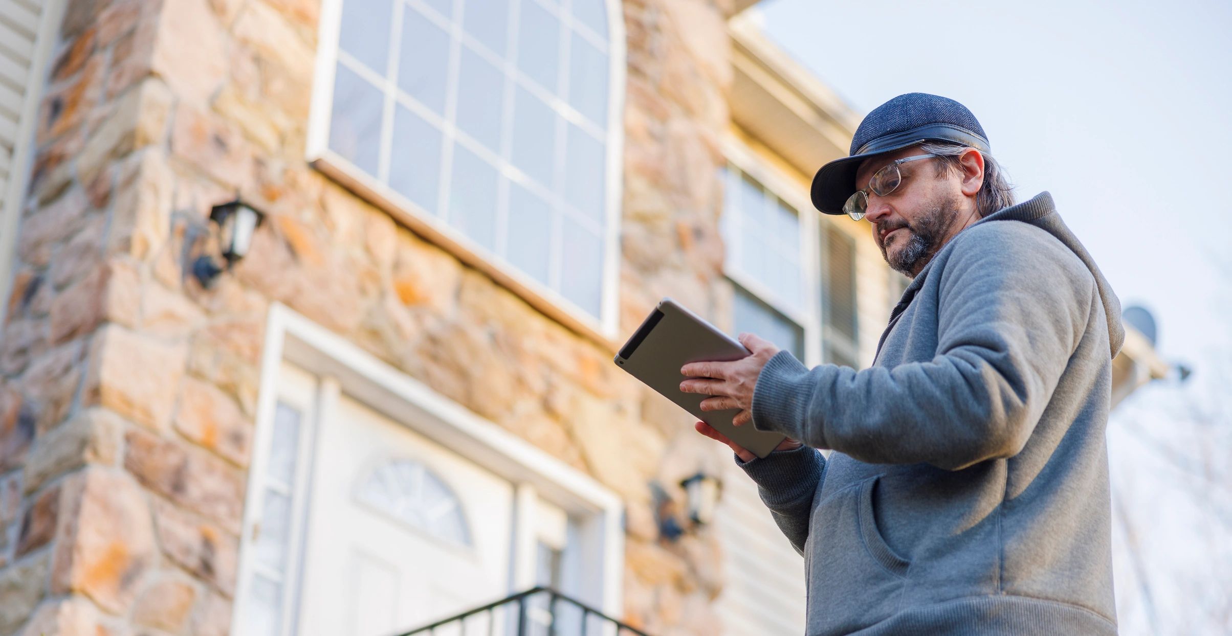 Assessor using a tablet during a property inspection