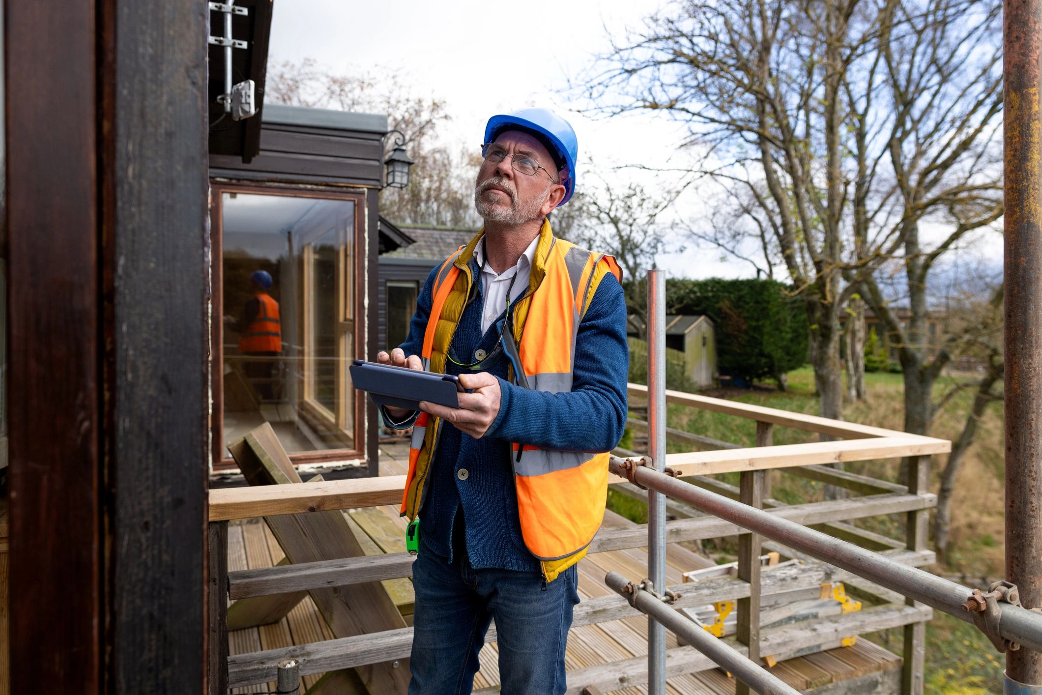 EPC assessor using a tablet during a property inspection