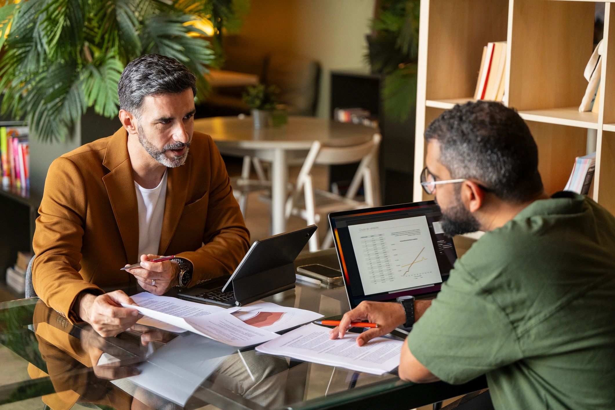 Property professionals reviewing paperwork during a meeting